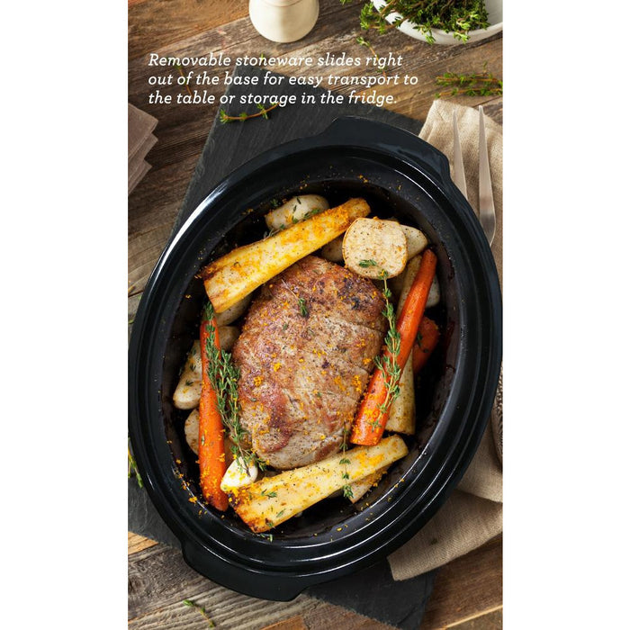 Removable stoneware slides right out of the base for easy transport to the table or storage in the fridge. Large roast and vegetables are cooking inside inner pot.