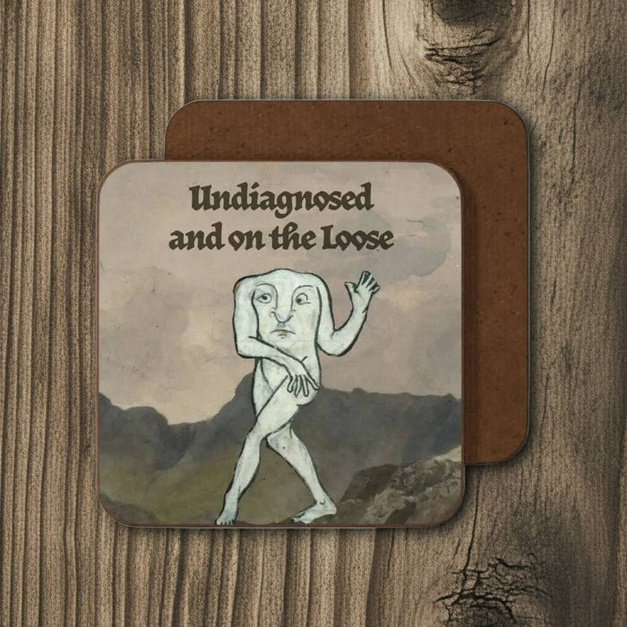 Betiobca coaster: Quirky torso-faced creature; “Undiagnosed and On the Loose”, perfect funny medieval style novelty gift.