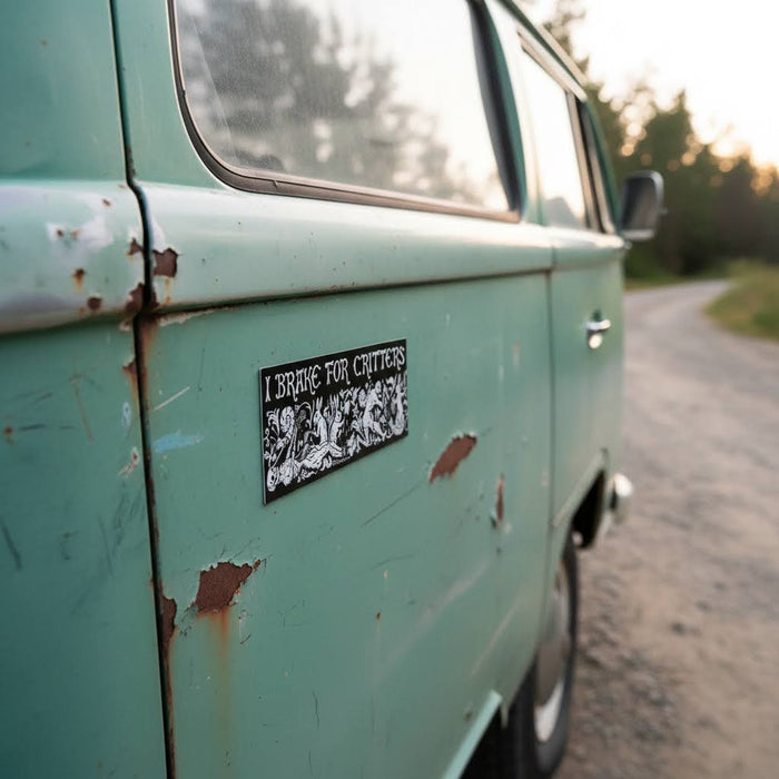 Forager Provisions LTD Cat Coven I Brake For Critters rectangular magnet on a vintage teal campervan door