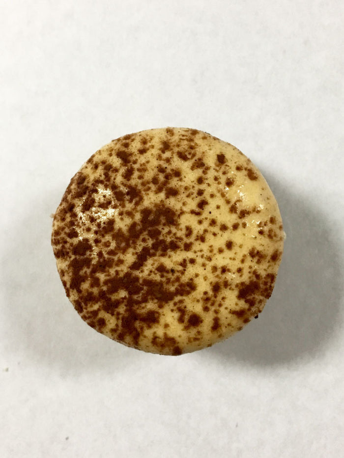 Coffee Mocha Macaron with a dark Ivory and dusted cocoa powder shell