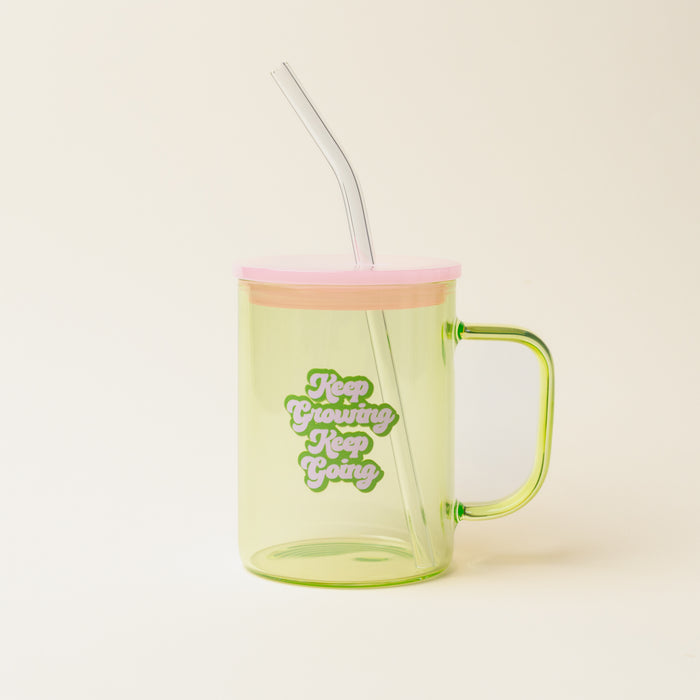 The Darling Effect's Green Keep Going Keep Growing Color Glass Mug with Handle features a light green glass, pink lid, clear straw, and the inspiring text: Keep Growing, Keep Going.