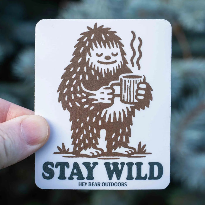 Forager Provisions LTD Hey Bear Outdoors sticker featuring a brown Bigfoot drinking coffee with Stay Wild text