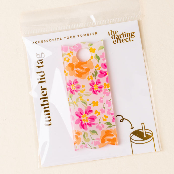 The Secret Garden Pink Tumbler Lid Tag by the-darling-effect features pink, orange, and yellow flowers. Part of our acrylic tumbler accessories, itβs packaged in a clear sleeve labeled Accessorize Your Tumbler and The Darling Effect.