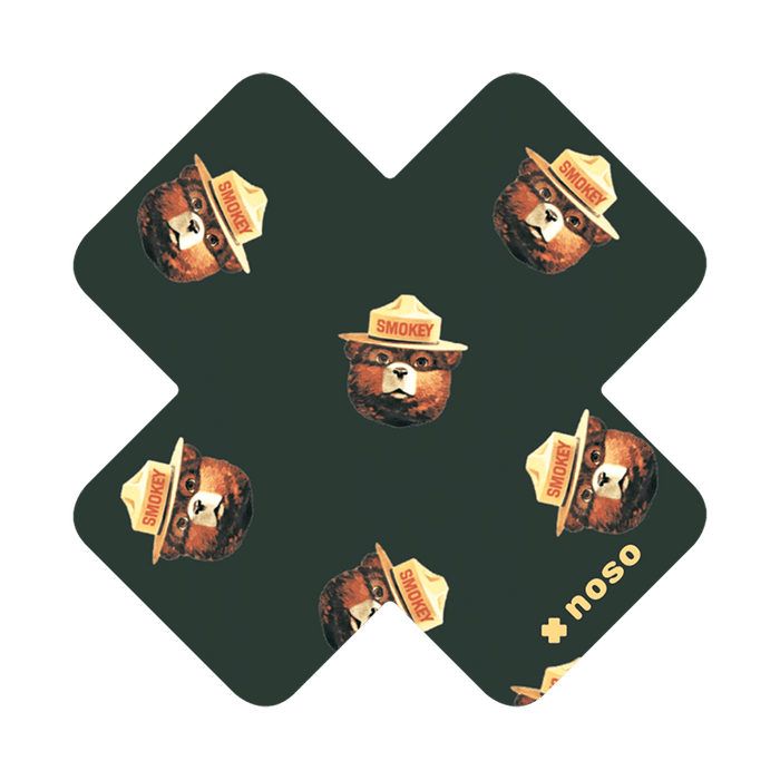 Forager Provisions LTD Smokey Bear Head Toss x NoSo waterproof repair patch with a repeating bear face pattern.