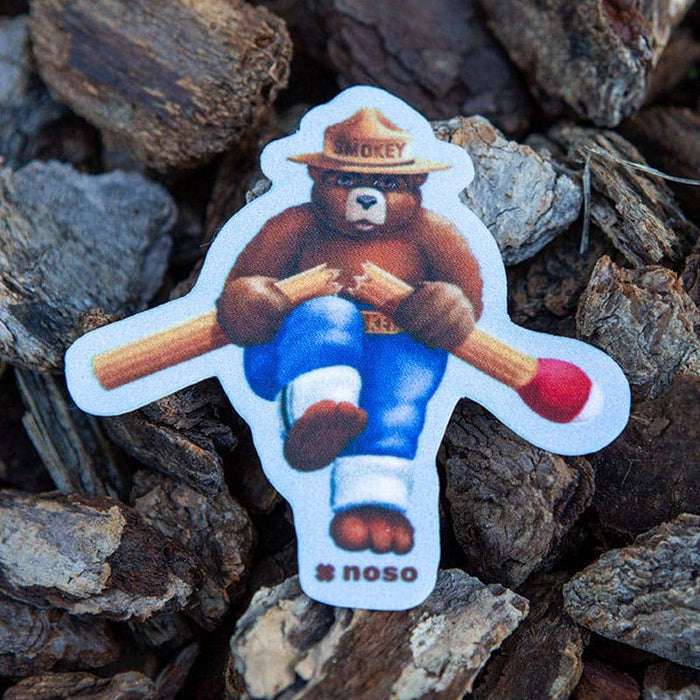 Forager Provisions LTD Smokey Bear Think Before You Strike NoSo repair patch on textured tree bark background