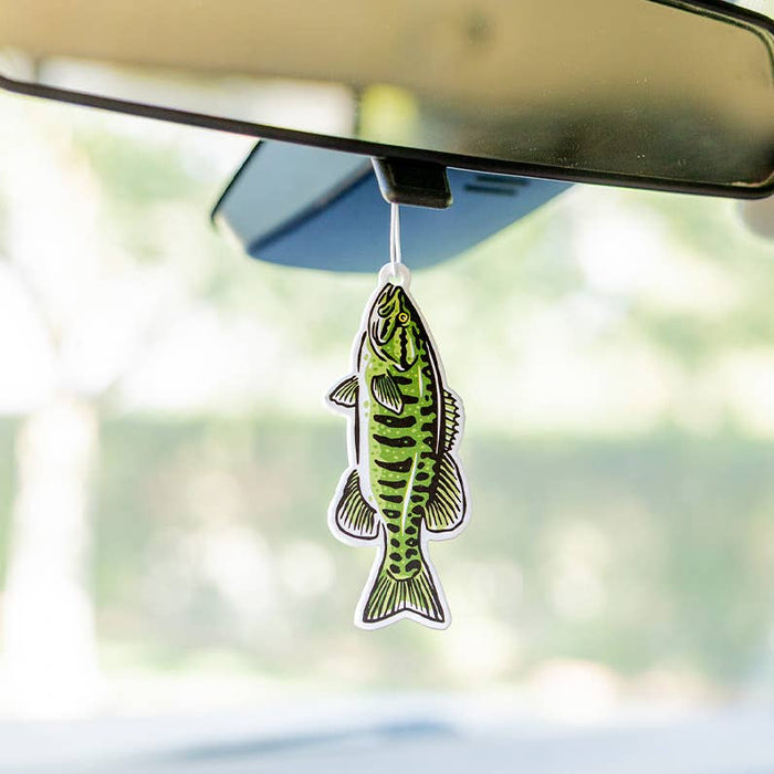 Forager Provisions LTD Smallmouth Bass air freshener hanging from a car rearview mirror with wild lemongrass scent.