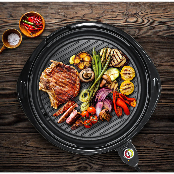 Various foods of meat and vegetable grilled on the grill surface.