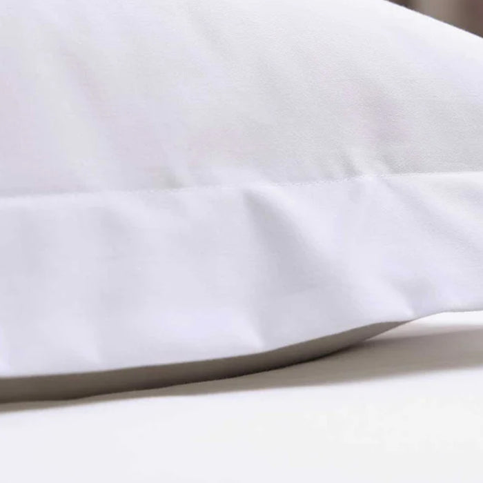 Close-up of a300TC Cotton White Pillowcase on a light background