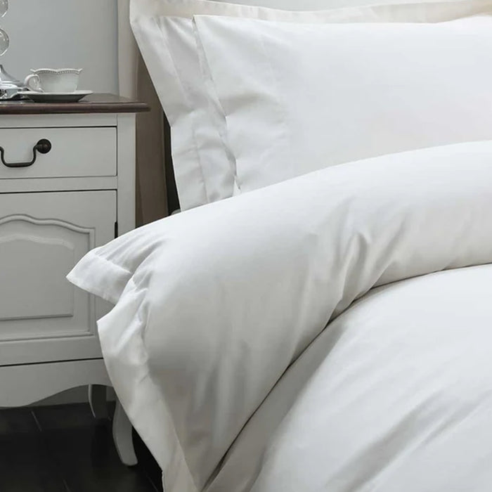 500TC Egyptian Cotton Ivory Duvet Cover Set on a bed with a nightstand in the background