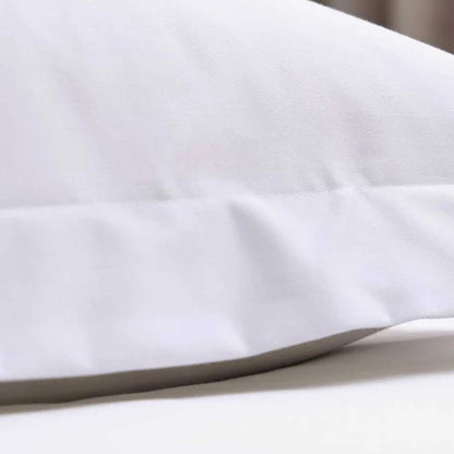 Close-up of 500TC Egyptian Cotton White Pillowcase on a bed