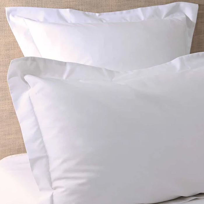 500TC Egyptian Cotton White Pillowcase on a beige bed background