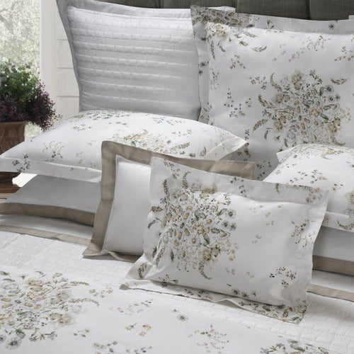 Alena pillowcase sham and duvet cover  on a bed with a neutral color scheme.
