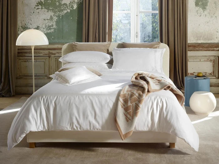Alvorada pillowcasr sham and duvet cover on a bed in a bedroom setting