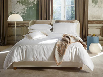Alvorada pillowcasr sham and duvet cover on a bed in a bedroom setting