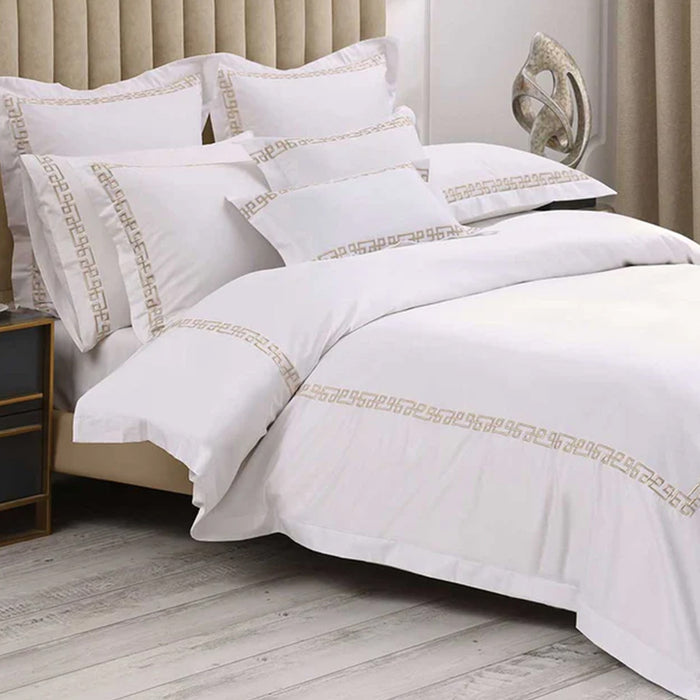 Ares Champagne Duvet Cover Set on a bed in a bedroom setting.