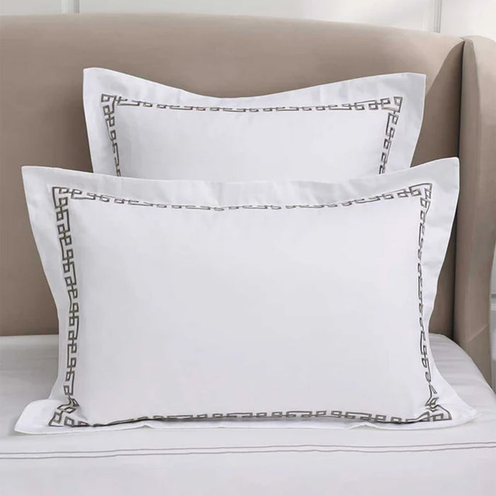 Ares Mercury Pillowcase and Cushion on a beige sofa.