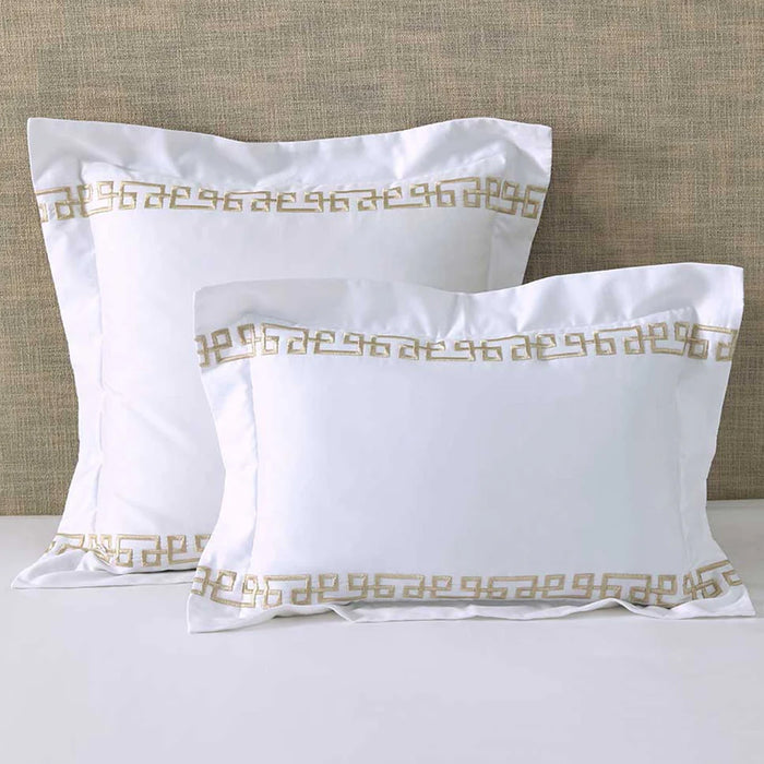 Ares Champagne Pillowcase and Cushion on a beige textured background