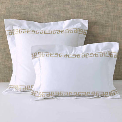 Ares Champagne Pillowcase and Cushion on a beige textured background