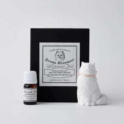 Handmade Tokyo plaster chiffon cat aroma oil diffuser ornament, pink ribbon accent, elegant in black gift box, perfect decor.