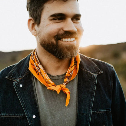 Forager Provisions LTD Bandits Bandanas Free Spirit organic cotton bandana worn as a neckerchief by a smiling man