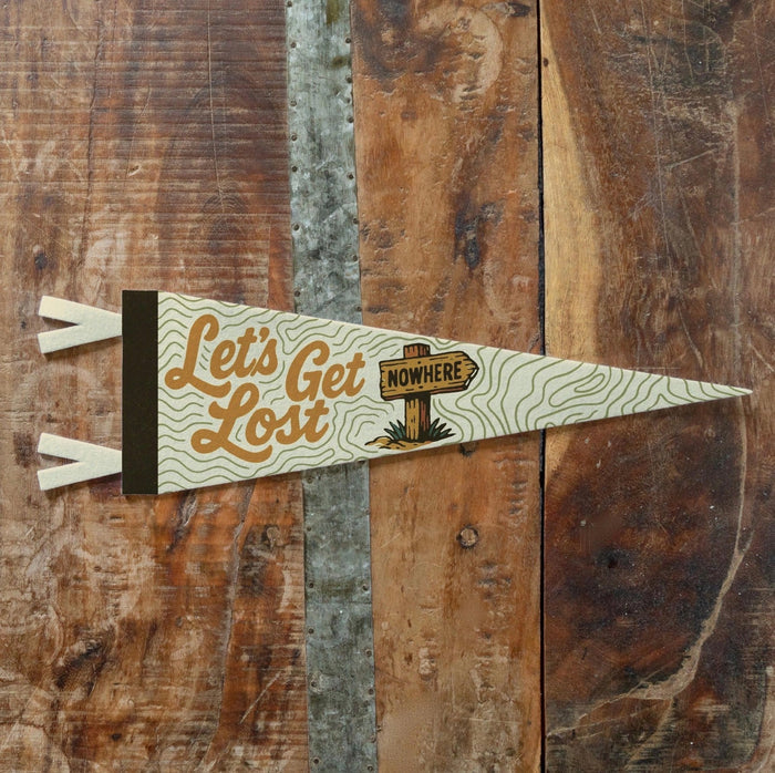 Forager Provisions LTD Benoit’s Design Co vintage felt pennant with Let’s Get Lost typography on a wooden background
