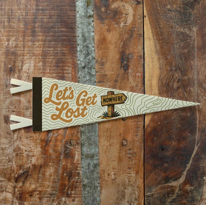Forager Provisions LTD Benoit’s Design Co vintage felt pennant with Let’s Get Lost typography on a wooden background