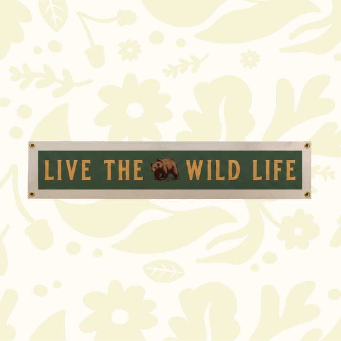 Forager Provisions LTD Benoit Design Co felt pennant banner featuring Live The Wild Life text and a bear illustration.