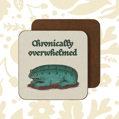 Blue spotted frog under “Chronically overwhelmed” text on Betiobca Medieval Overwhelmed Frog Coaster, unique gift idea.