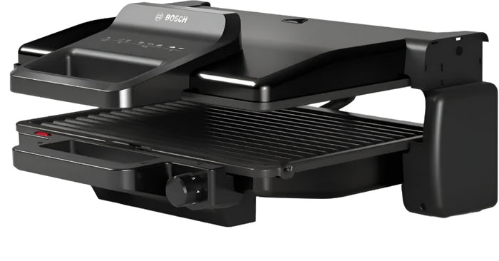 Black grill with open lid on a white background