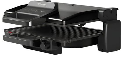 Black grill with open lid on a white background