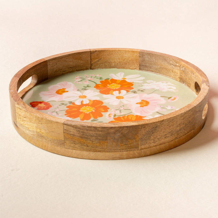 The-darling-effect's Bouquet Beauty Sage Large Round Wood Enamel Tray features side handles and a floral design with orange, white, and pink flowers on a light green background.