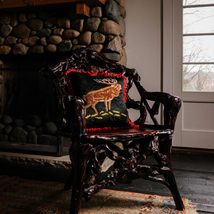 Cozy lodge decor: Peking Camp Wandawega Elk Pillow 18X18 by rustic stone fireplace, perfect for cabin or camp style rooms.