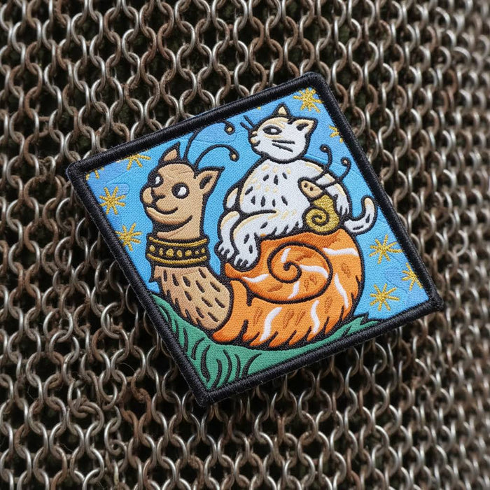 Forager Provisions LTD Cat Coven Chosen Family woven patch featuring a cat riding a snail on a chainmail background.