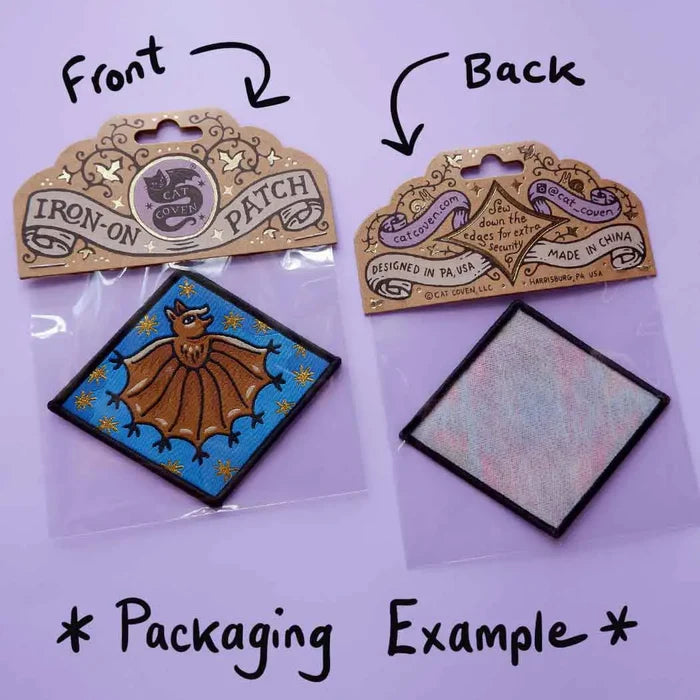 Cat Coven Chosen Family Woven Patch packaging, front and back views showing intricate design details and handwritten label text.