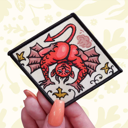 Forager Provisions LTD Cat Coven Fart Demon iron-on embroidered patch with a red devil character on a diamond shape.