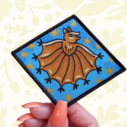 Forager Provisions LTD Cat Coven Handsy Bat iron-on embroidered patch featuring a brown bat on a bright blue background.