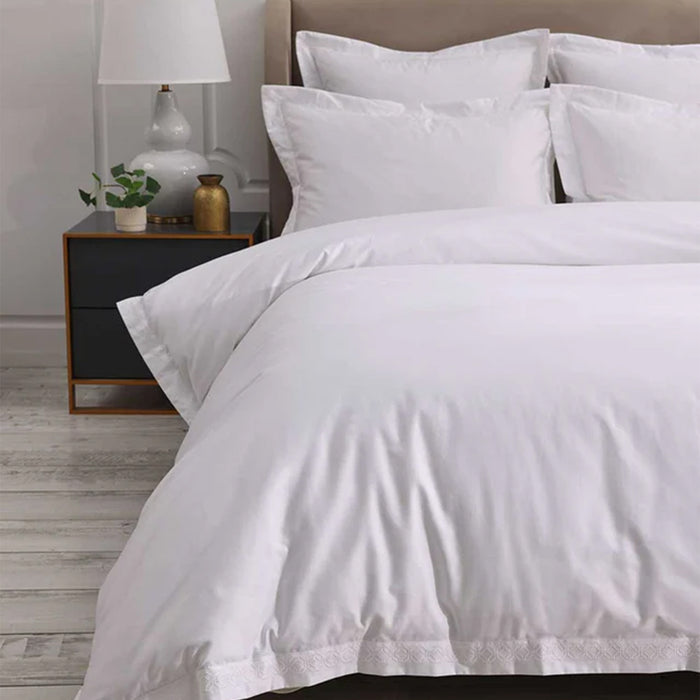 Cavendish White Duvet Cover Set on a bed with a nightstand in the background
