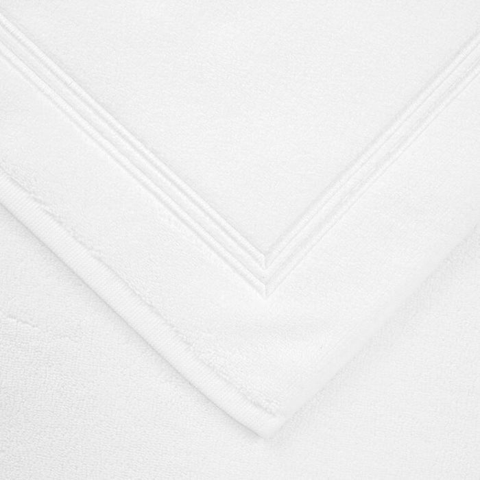 close up shot of the details and fabric of a white white Classic Bath Mat