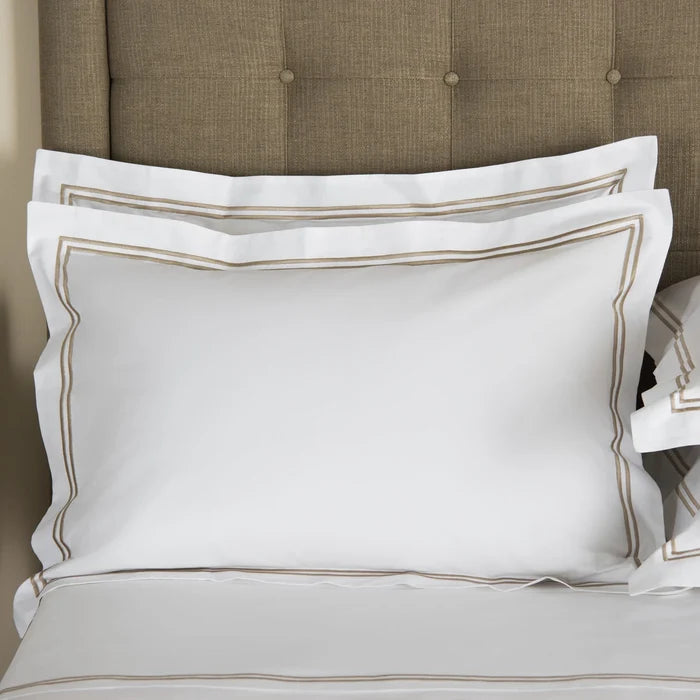 front view of classic pillowcase sham white khaki on a bed