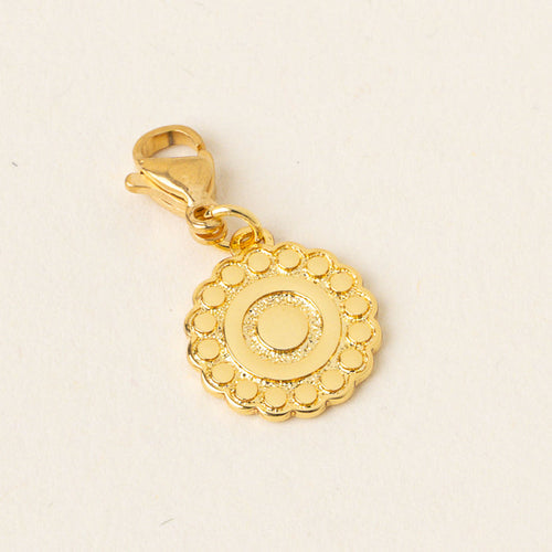 The-darling-effect’s Confident Jewelry Trait Charm Gold features a scalloped edge, concentric circle design, and lobster clasp—perfect as a confidence or strength charm. Shown on a light background; part of our Jewelry Trait Charms collection.