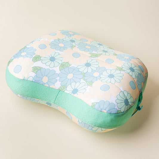 The Darling Effect's Daisy Craze Aqua Ballast Beach Pillow is rectangular with rounded edges, featuring a light floral fabric in blue, white, and green, plus a solid mint green border for a limited-edition burst of color.