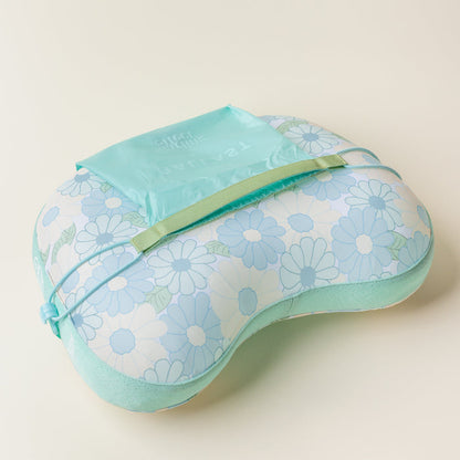 The Darling Effect’s Daisy Craze Aqua Ballast Beach Pillow is shown with a light blue floral print, green trim, and a teal crinkled pouch with white lettering—perfect as a stylish beach pillow for little travelers.