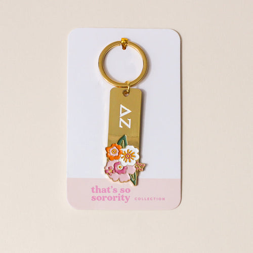 The Darling Effect’s Delta Zeta Enamel Keychain features white DZ letters with colorful floral enamel details. Packaged in the “That’s So Sorority” collection, it’s the perfect sorority gift.