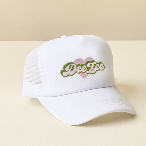 The Darling Effect Delta Zeta White Trucker Hat features a pink heart and green embroidered Dee Zee lettering—perfect for showing your chapter pride.