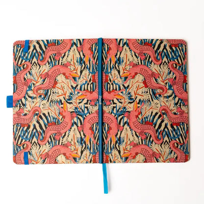 Denik Animal Print Soft Touch Layflat Notebook with pink dragon cover, hardbound spine, and blue ribbon bookmark.