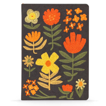 Forager Provisions LTD Denik journal with a black cover featuring textured, chunky folk-style embroidered flowers.