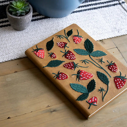 Forager Provisions LTD Denik journal with tan cover featuring raised red strawberry and green leaf embroidery