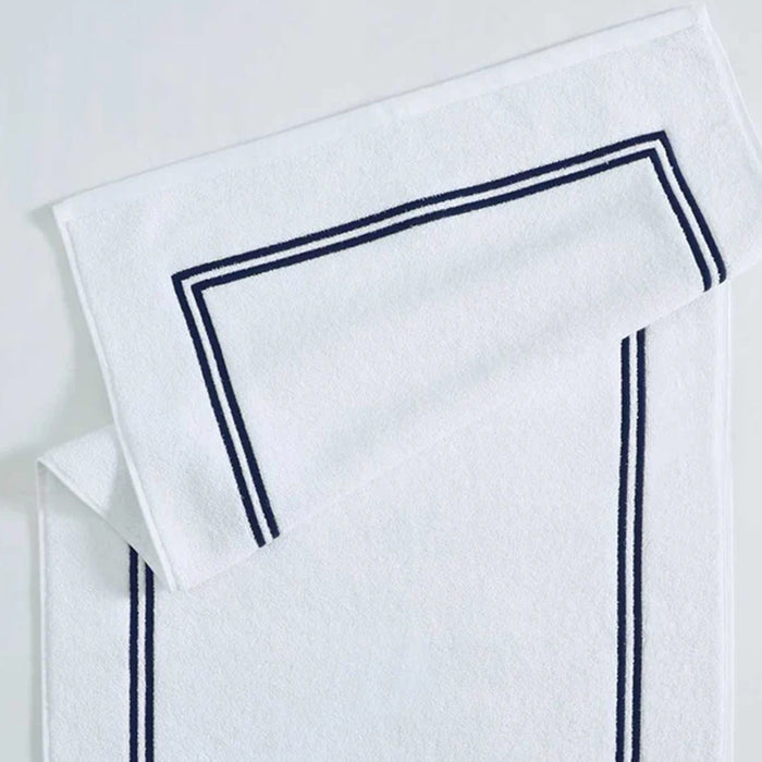 Empire Bath Mat White Navy on a light gray background
