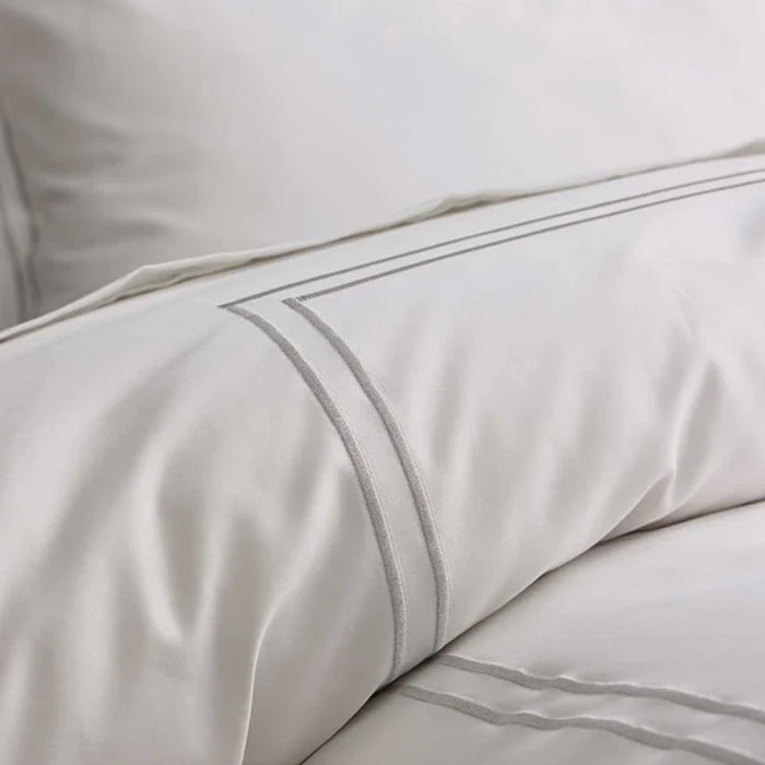 Close-up of Empire Silver Duvet Cover set on a white background