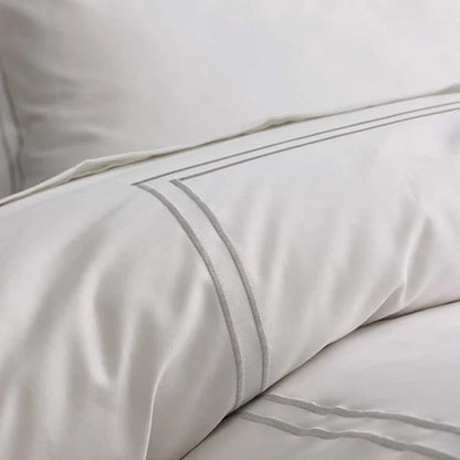 Close-up of Empire Silver Duvet Cover set on a white background